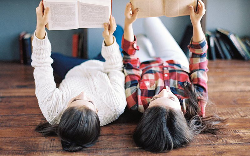 Students Studying While Lying On The Floor